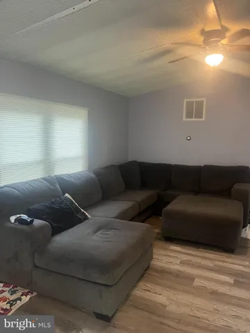 a living room with couches and a coffee table
