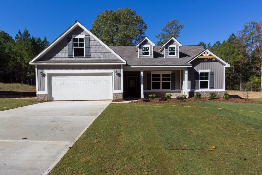 170 Eryn Terrace Covington, GA 30014 - Photo 1 of 1 a front view of a house with a yard and garage