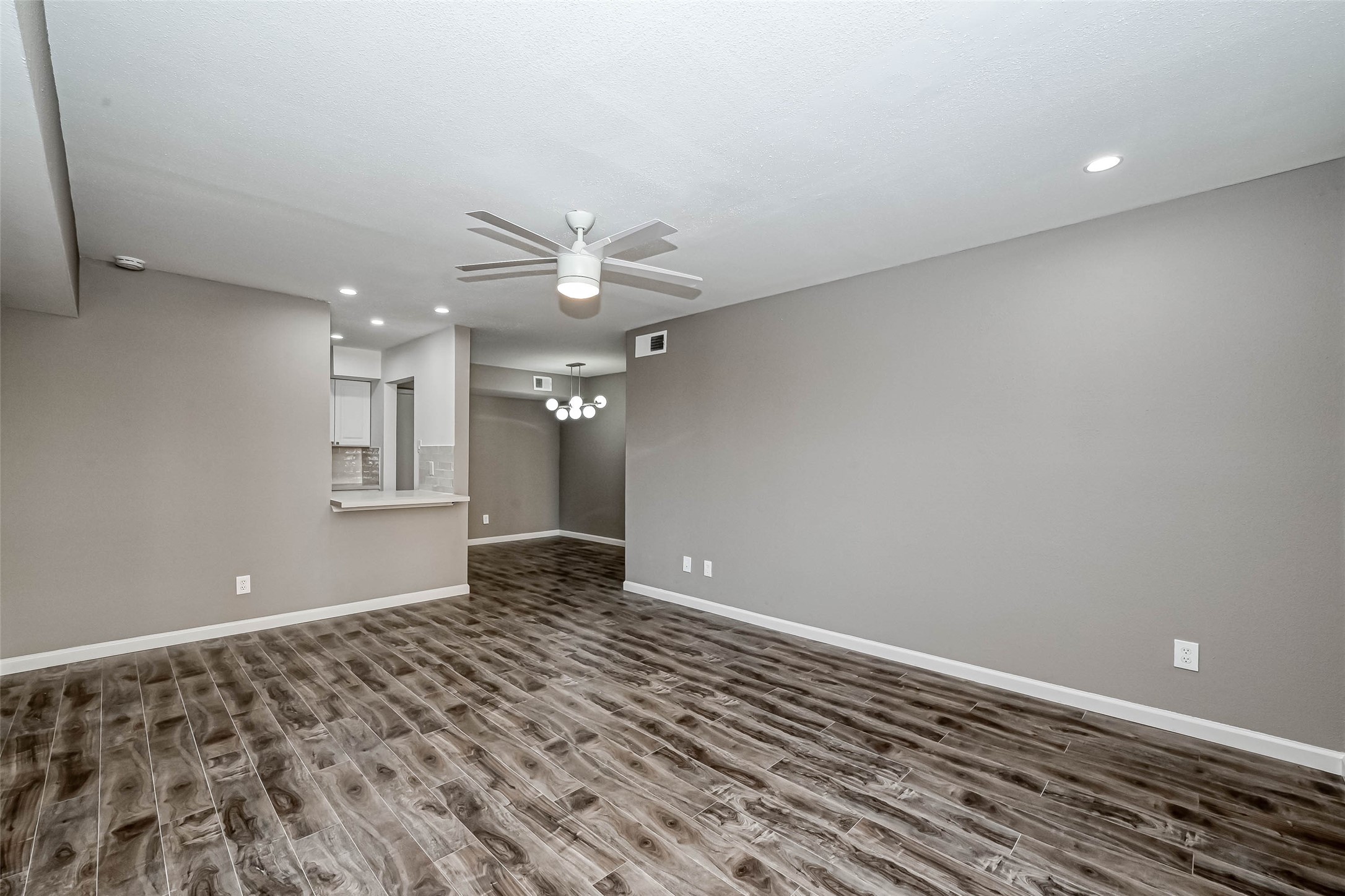 4645 Wild Indigo Street, Unit 375 Houston, TX 77027 - Photo 13 of 27 wooden floor in an empty room