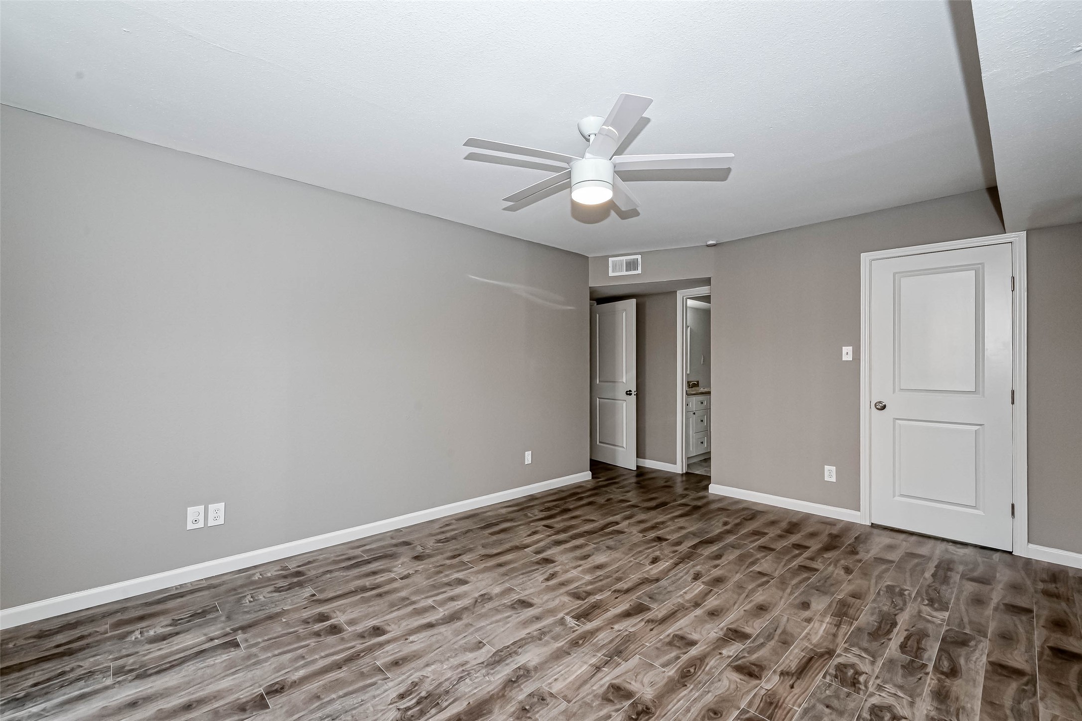 4645 Wild Indigo Street, Unit 375 Houston, TX 77027 - Photo 17 of 27 wooden floor in an empty room