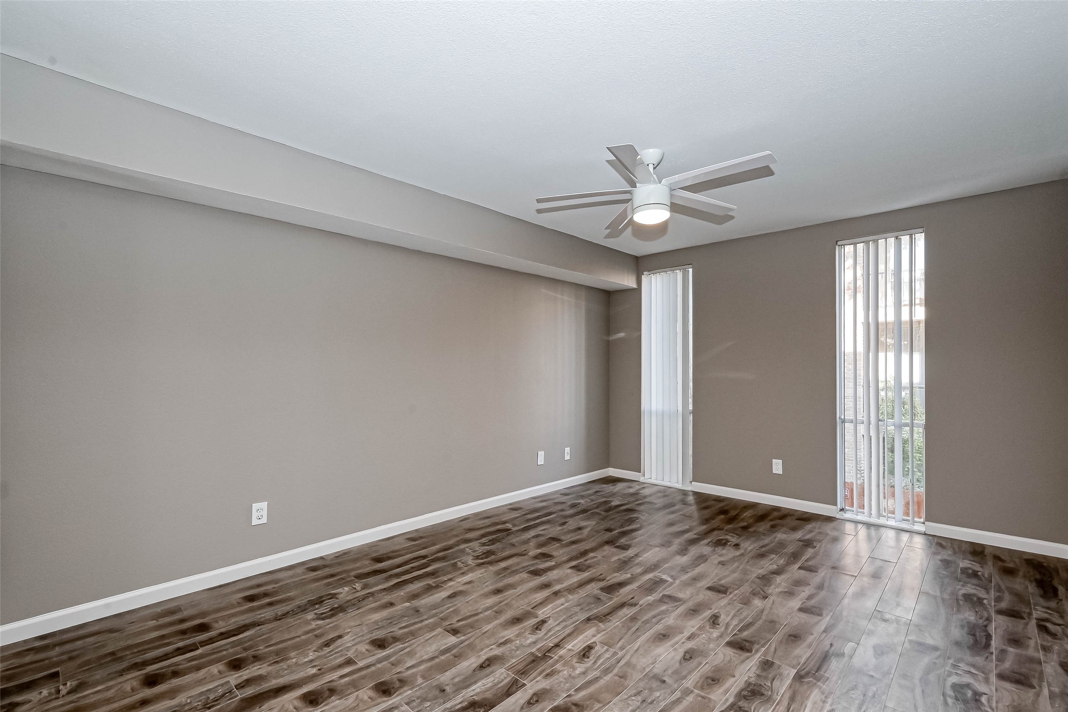 4645 Wild Indigo Street, Unit 375 Houston, TX 77027 - Photo 19 of 27 wooden floor in an empty room with a window