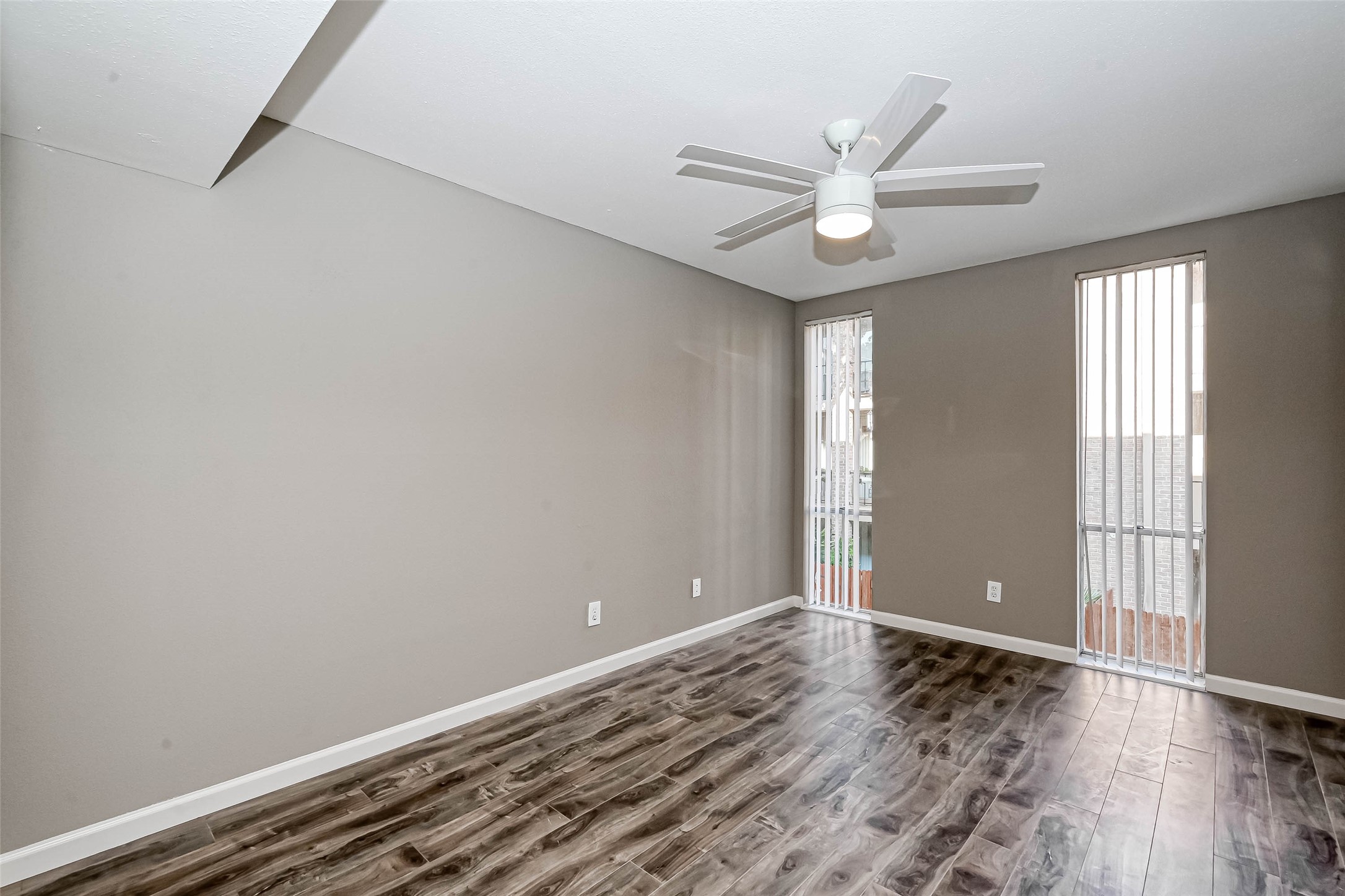 4645 Wild Indigo Street, Unit 375 Houston, TX 77027 - Photo 23 of 27 wooden floor in an empty room with a window