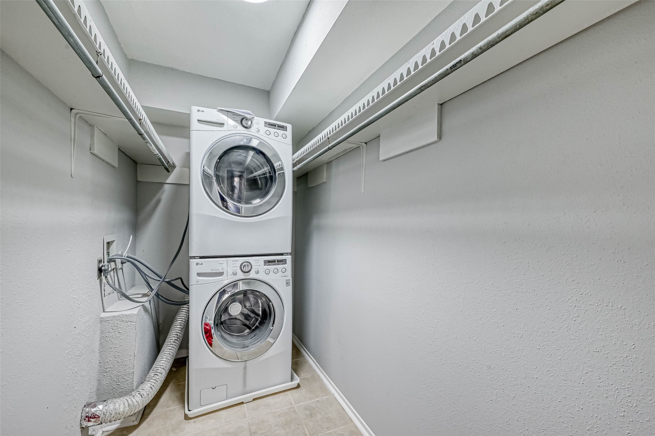 4645 Wild Indigo Street, Unit 375 Houston, TX 77027 - Photo 24 of 27 a utility room with dryer and washer