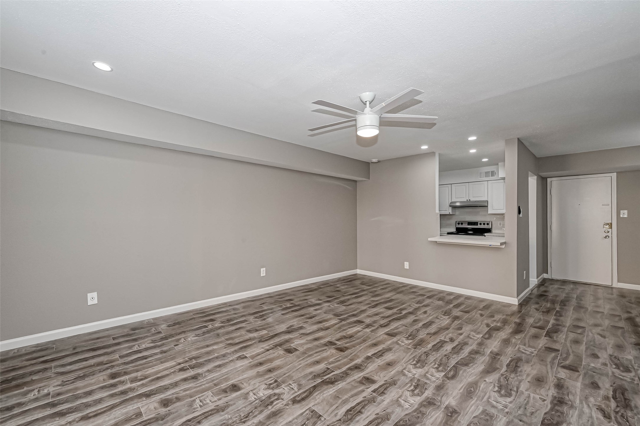 4645 Wild Indigo Street, Unit 375 Houston, TX 77027 - Photo 8 of 27 a view of a kitchen with a sink and a refrigerator