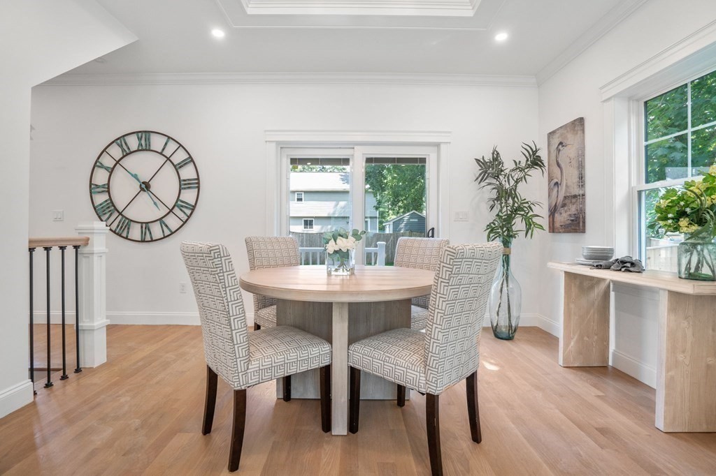 504 Hudson Road Sudbury, MA 01776 - Photo 11 of 42 a view of a dining room with furniture window and wooden floor