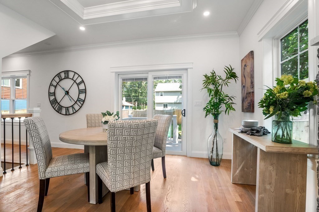 504 Hudson Road Sudbury, MA 01776 - Photo 13 of 42 a view of a dining room with furniture window and wooden floor