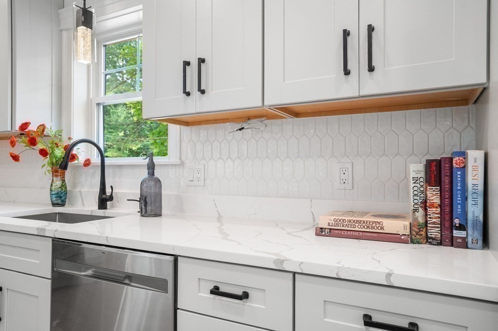 504 Hudson Road Sudbury, MA 01776 - Photo 16 of 42 a kitchen with a sink and a window