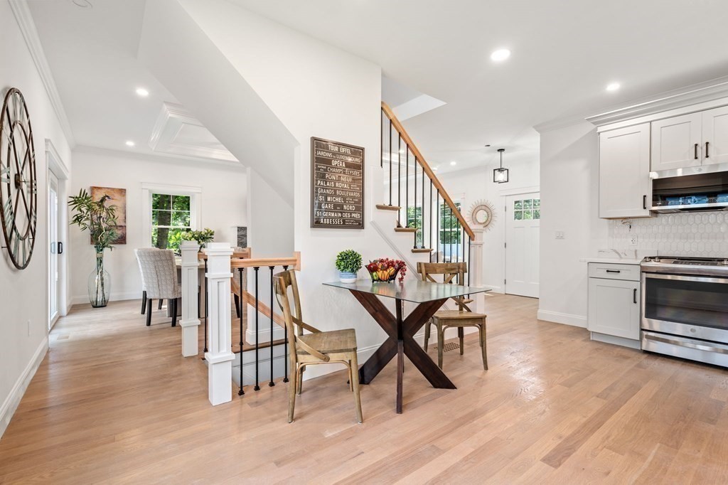 504 Hudson Road Sudbury, MA 01776 - Photo 18 of 42 a view of a dining room with furniture and wooden floor