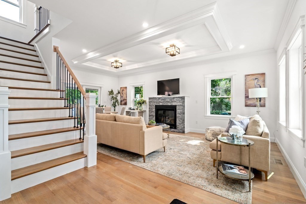 504 Hudson Road Sudbury, MA 01776 - Photo 22 of 42 a living room with furniture and a fireplace