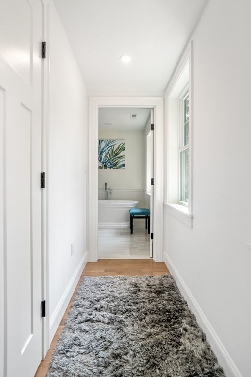 504 Hudson Road Sudbury, MA 01776 - Photo 25 of 42 a bathroom with a sink and a mirror