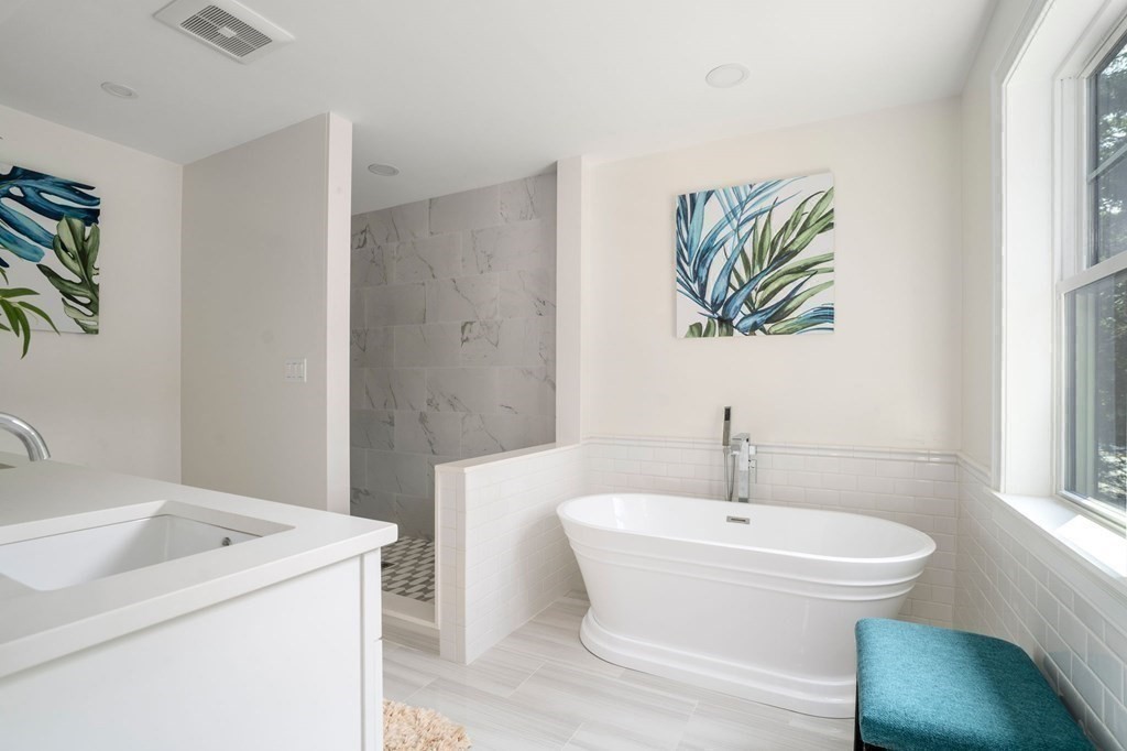 504 Hudson Road Sudbury, MA 01776 - Photo 26 of 42 a bathroom with a sink a toilet and vanity