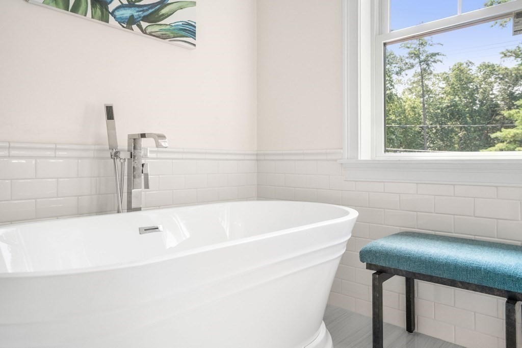 504 Hudson Road Sudbury, MA 01776 - Photo 29 of 42 a white bath tub sitting next to a window