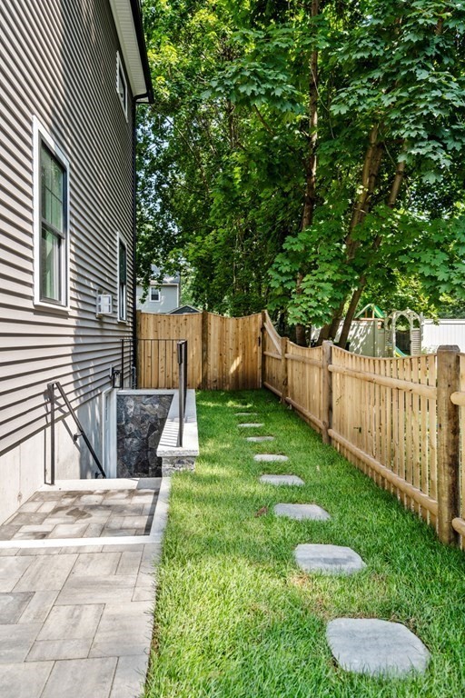 504 Hudson Road Sudbury, MA 01776 - Photo 38 of 42 a view of a backyard with a small cabin
