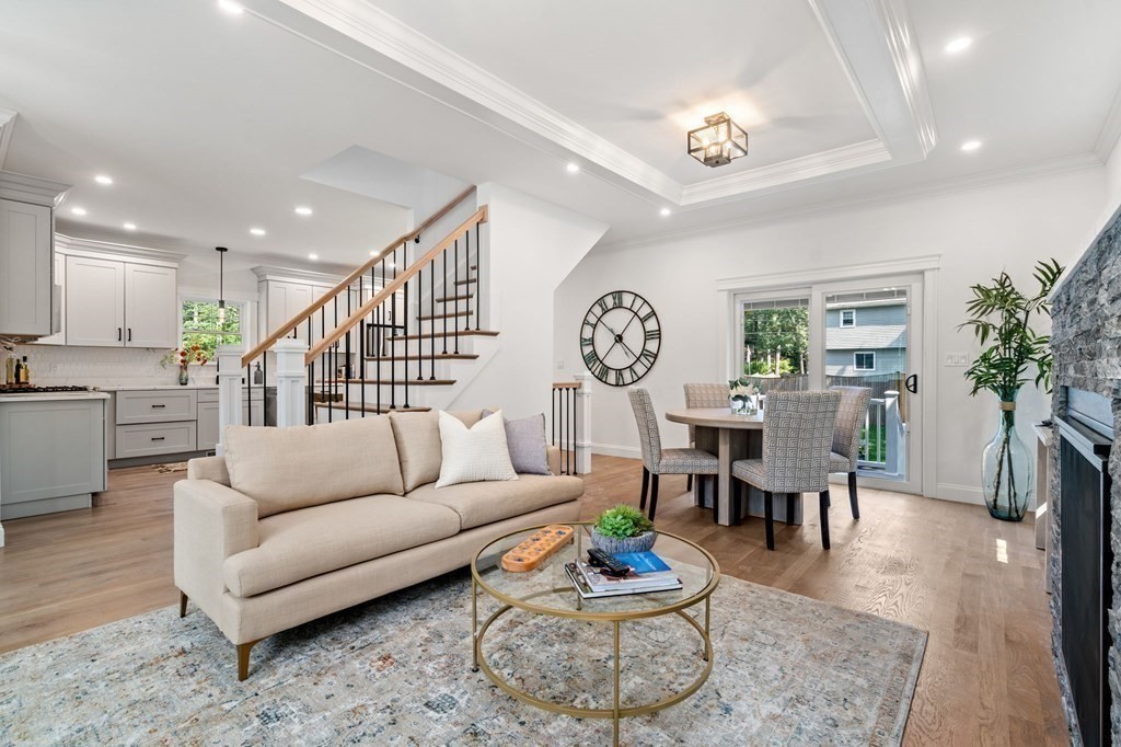 504 Hudson Road Sudbury, MA 01776 - Photo 7 of 42 a living room with furniture dining area and a table
