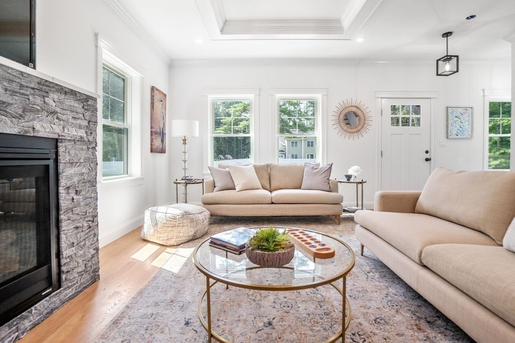 504 Hudson Road Sudbury, MA 01776 - Photo 10 of 42 a living room with furniture and a fireplace