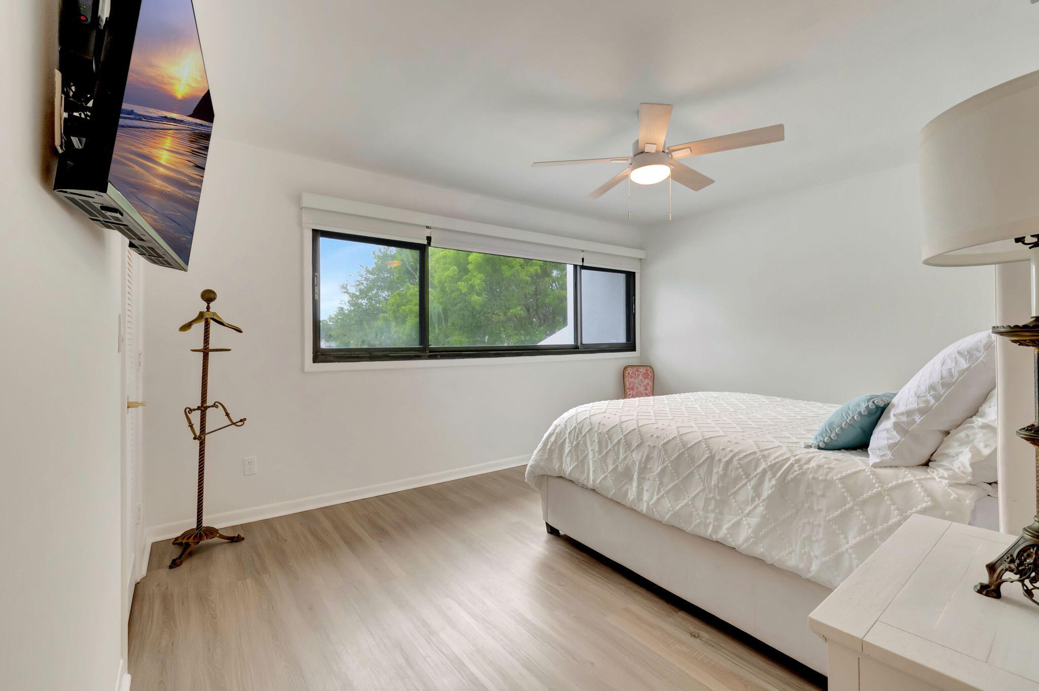 3310 Bridgewood Drive Boca Raton, FL 33434 - Photo 9 of 24 a bedroom with a bed and a window