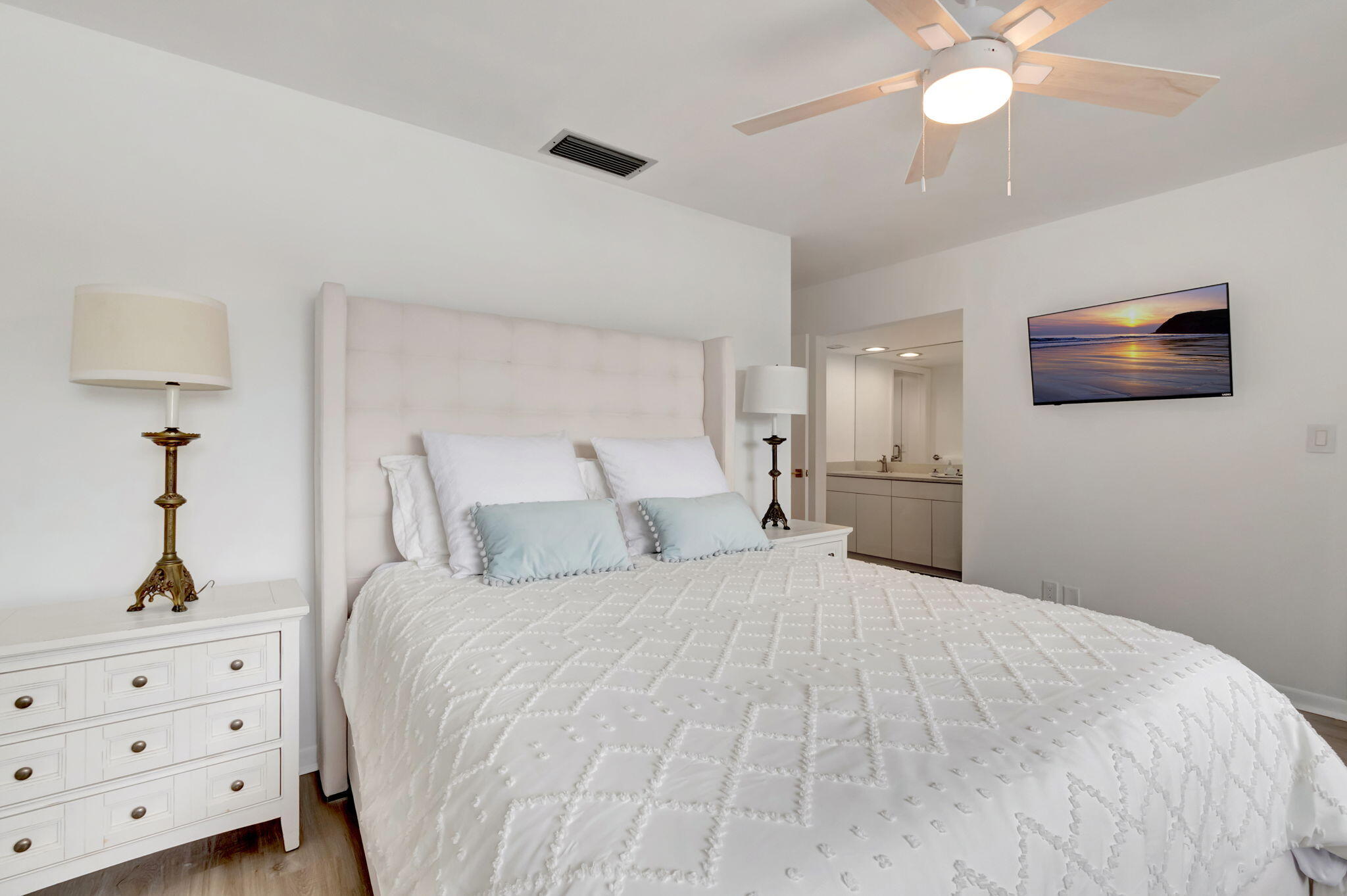 3310 Bridgewood Drive Boca Raton, FL 33434 - Photo 11 of 24 a bedroom with a bed and a chandelier