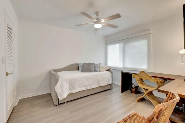 a bathroom with a double vanity sink mirror and toilet