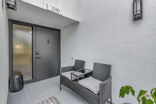 a view of a living room and washer and dryer