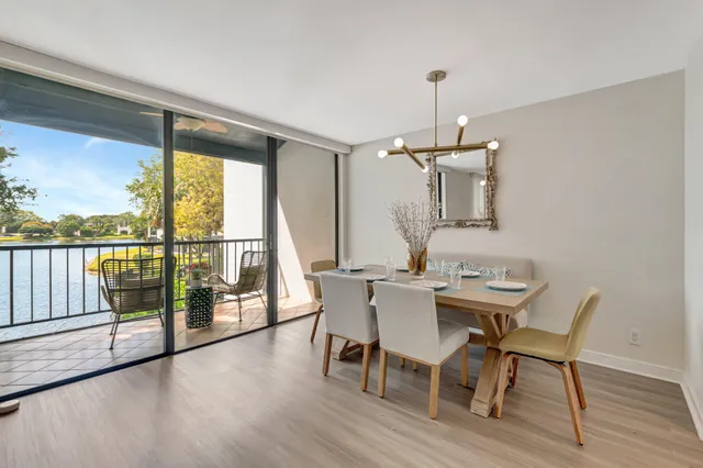 a view of a water pond with palm trees