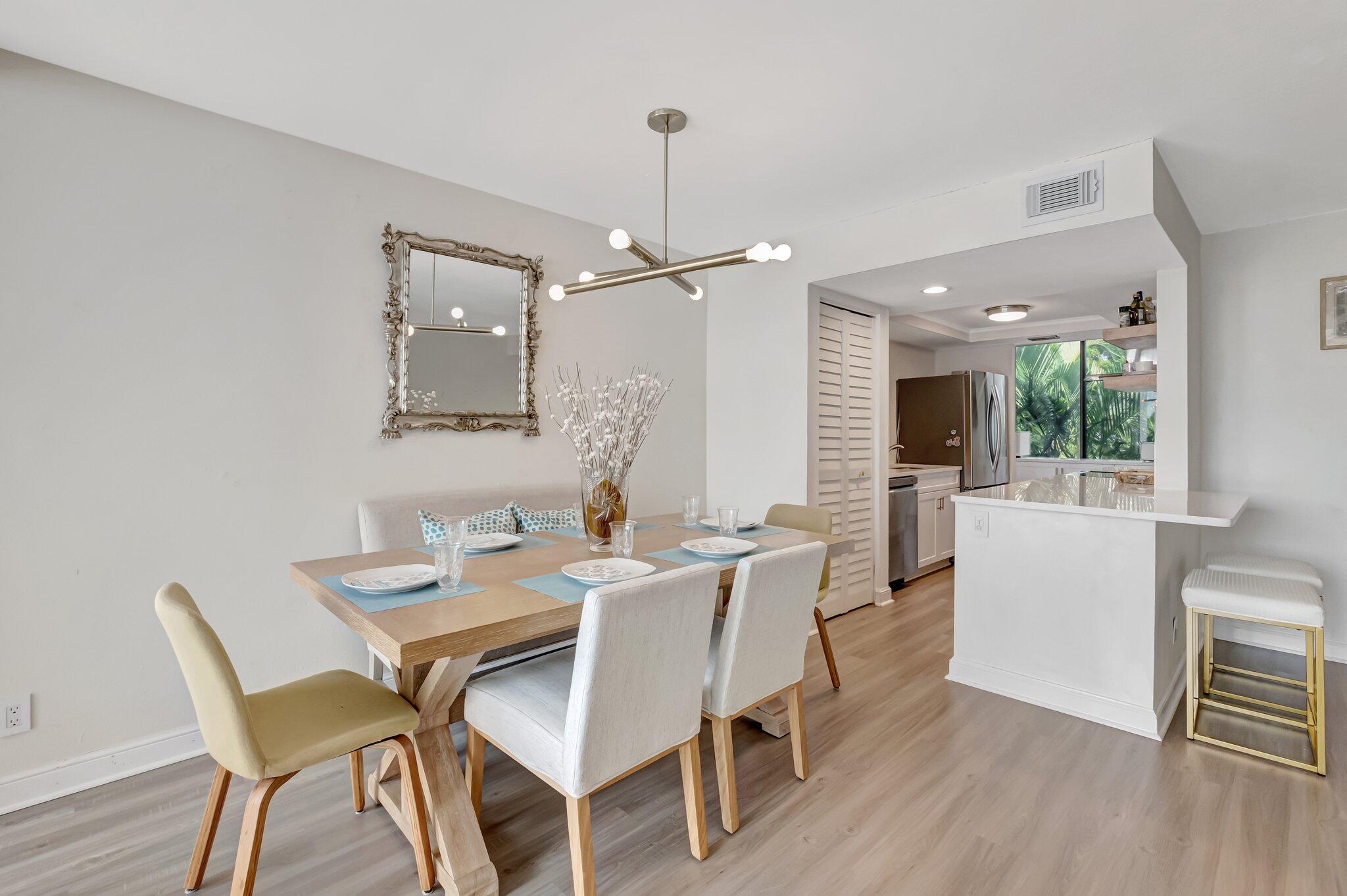 3310 Bridgewood Drive Boca Raton, FL 33434 - Photo 5 of 24 a dining room with furniture and window