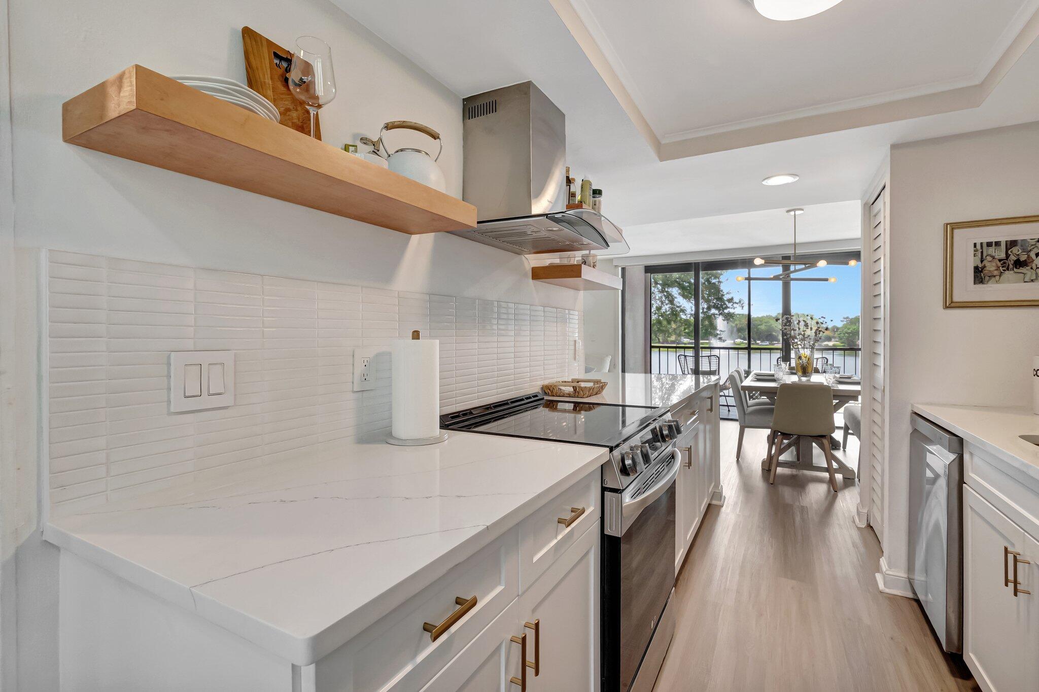 3310 Bridgewood Drive Boca Raton, FL 33434 - Photo 6 of 24 a kitchen with stove and cabinets