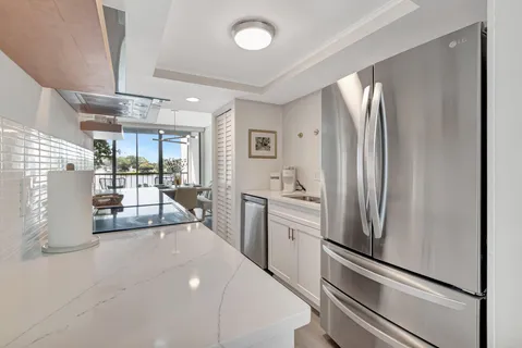 a kitchen with stove and cabinets
