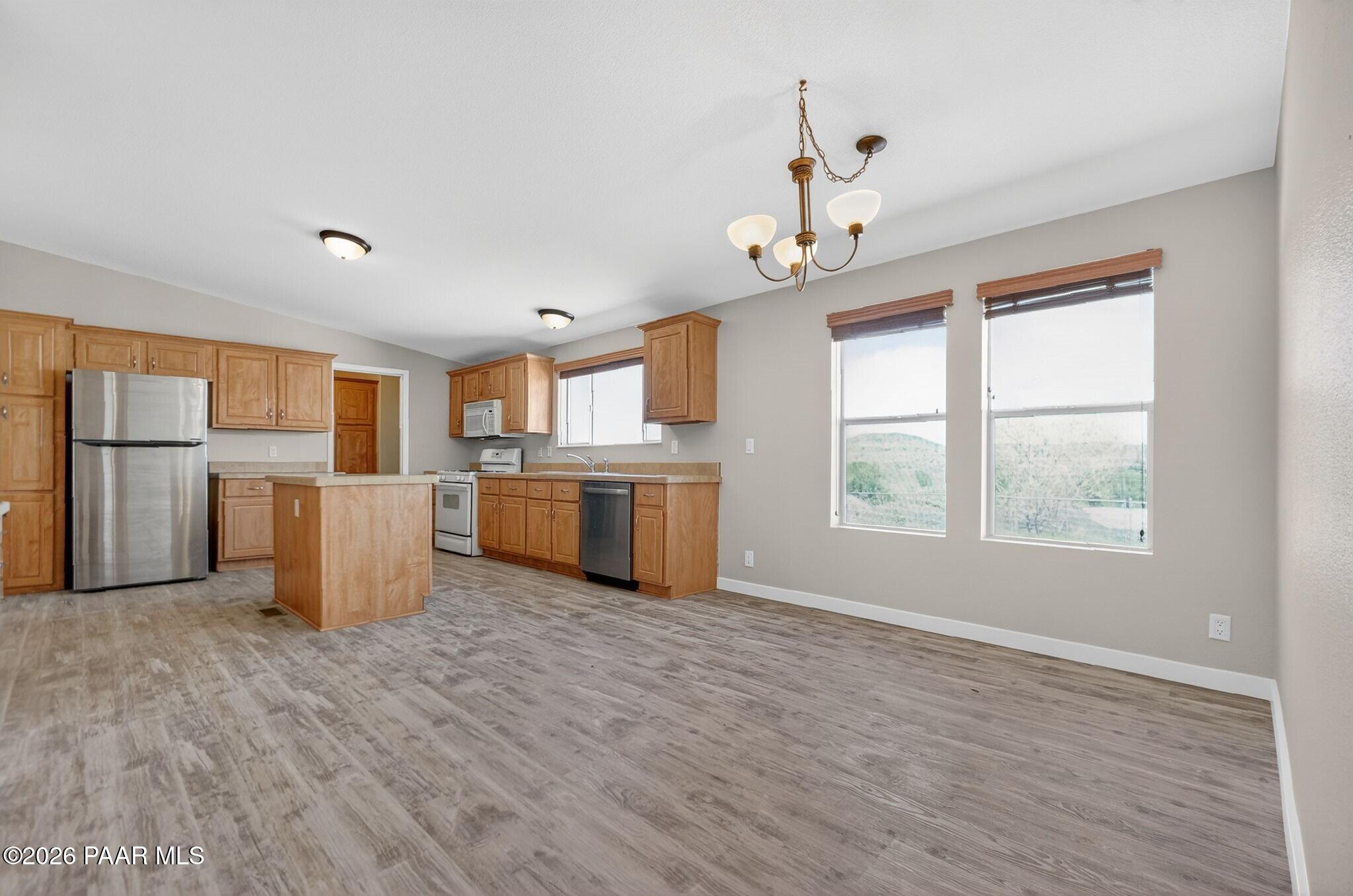 13230 East Main Street Mayer, AZ 86333 - Photo 15 of 32 a view of a kitchen with a sink dishwasher and a refrigerator