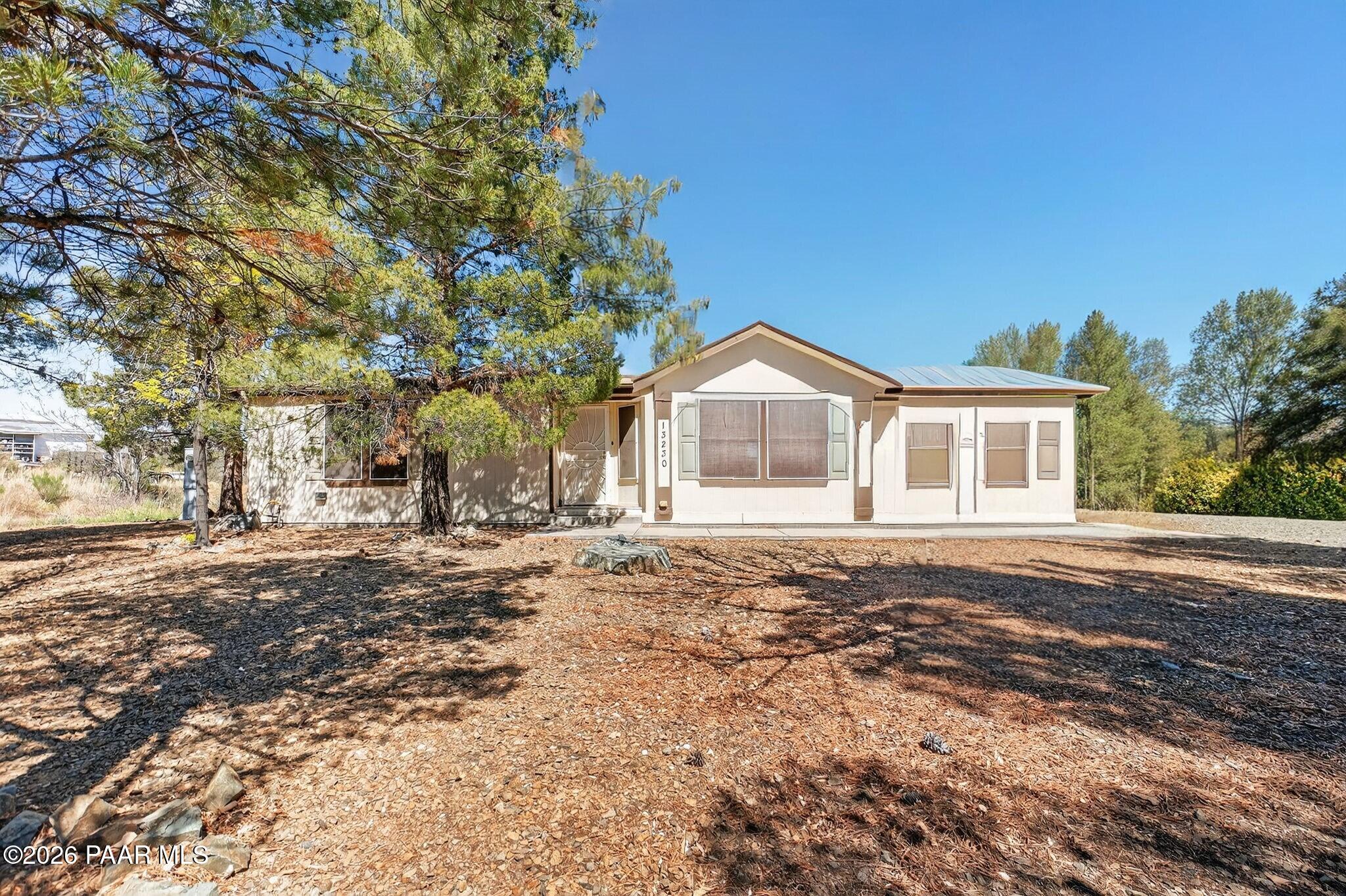 13230 East Main Street Mayer, AZ 86333 - Photo 2 of 32 a front view of a house with a yard