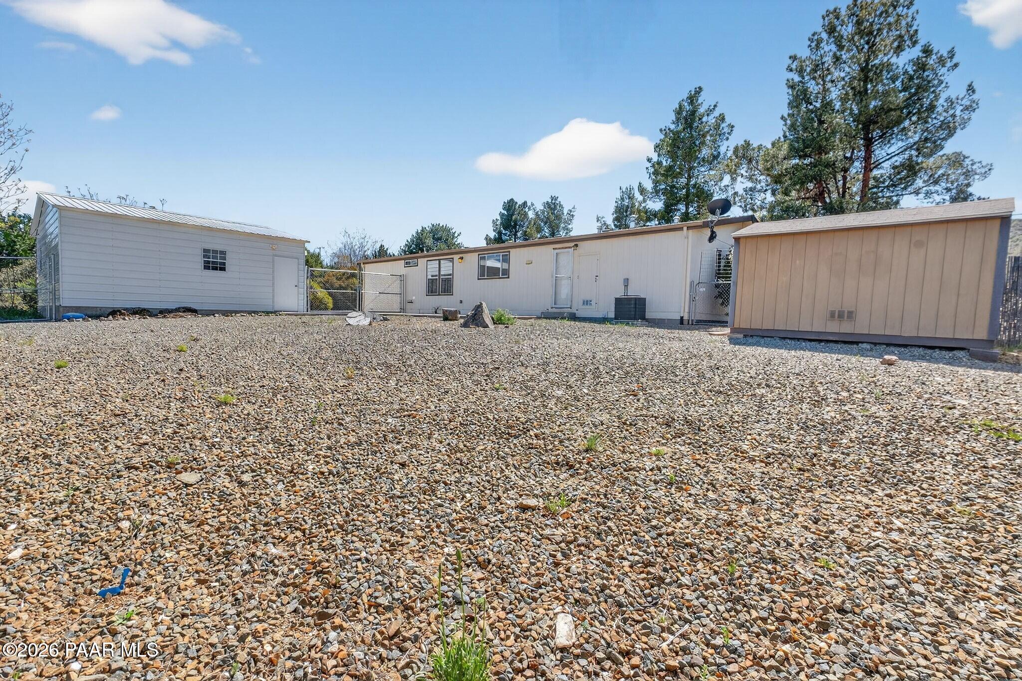 13230 East Main Street Mayer, AZ 86333 - Photo 30 of 32 a house view with a backyard space