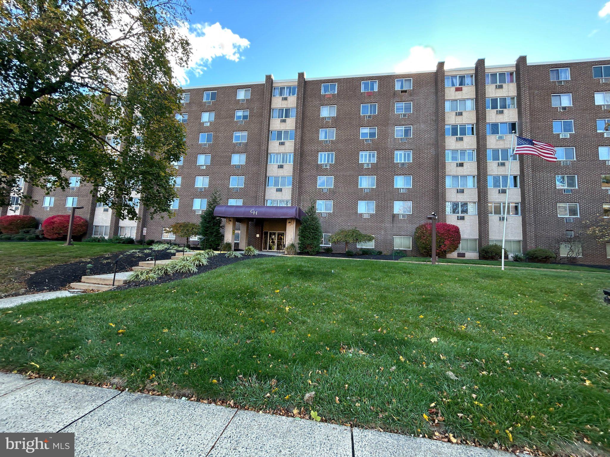860 Lower Ferry Road, Unit 6M Ewing, NJ 08628 - Photo 2 of 16 a building view with a garden space