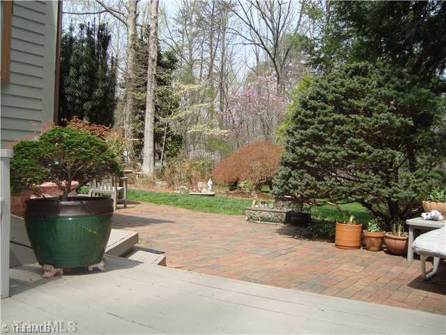 5070 Bunch Road Summerfield, NC 27358 - Photo 11 of 16 Other. A view from the side deck looking out to patio and rear gardens.