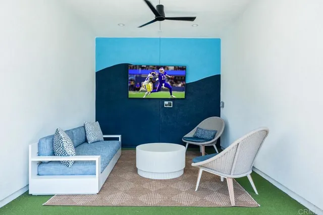 a view of a livingroom with furniture and windows