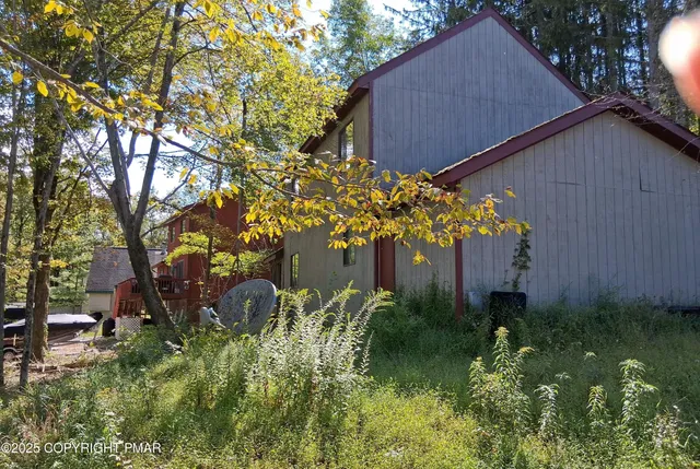 a backyard of a house with lots of green space