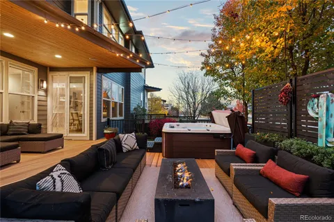 a outdoor living space with furniture and a fireplace