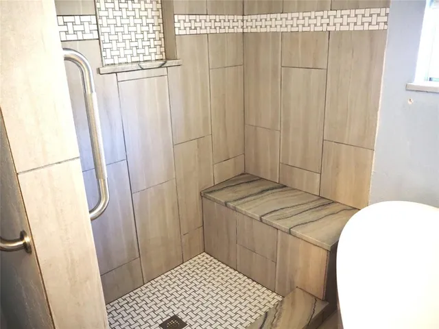 a bathroom with a sink a mirror and a lamp