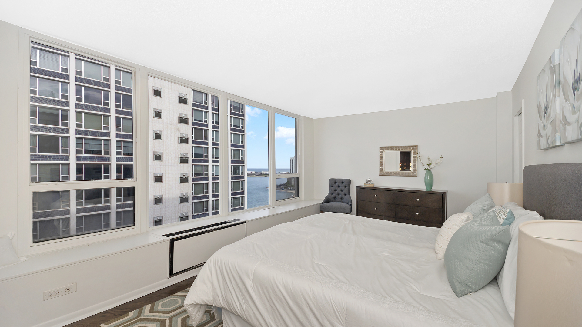 1313 North Ritchie Court, Unit 2405 Chicago, IL 60610 - Photo 12 of 26 a bedroom with a large bed and a window