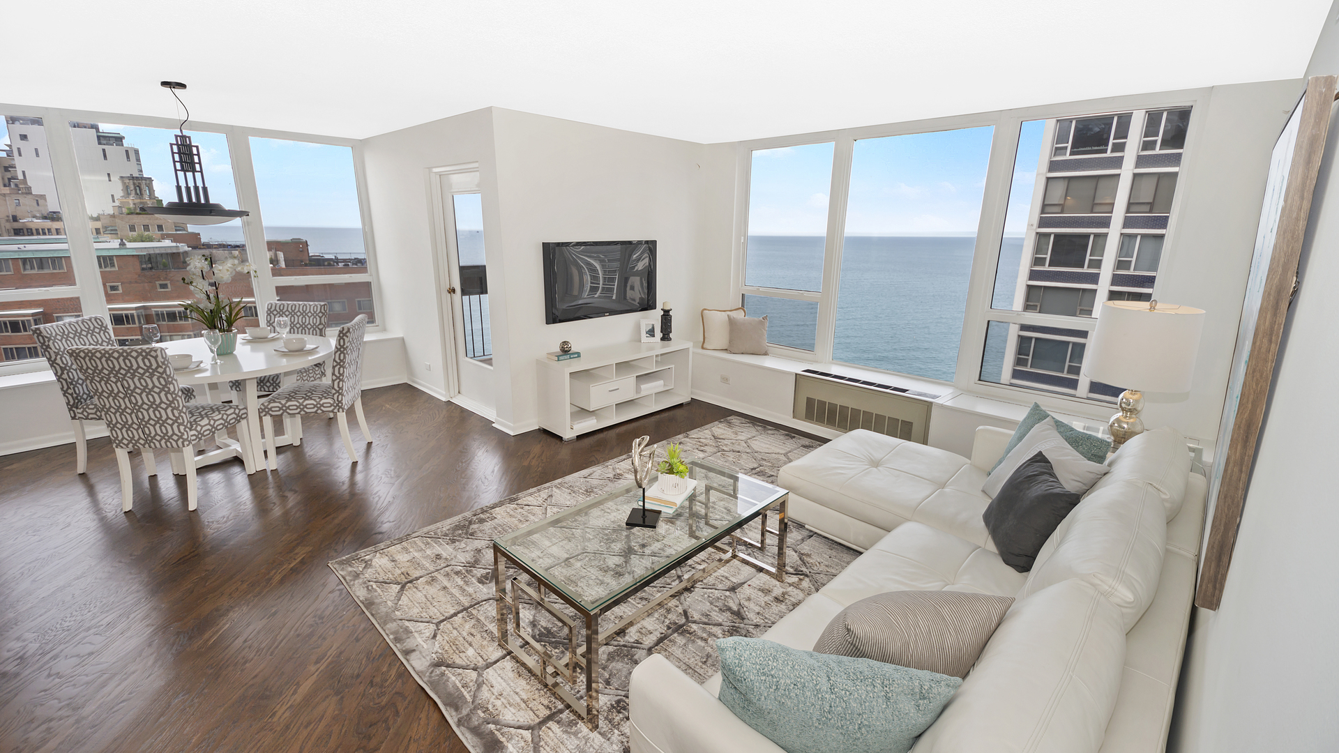 1313 North Ritchie Court, Unit 2405 Chicago, IL 60610 - Photo 3 of 26 a living room with furniture and a flat screen tv
