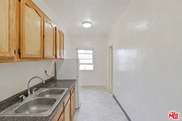a bathroom with a sink and a large mirror