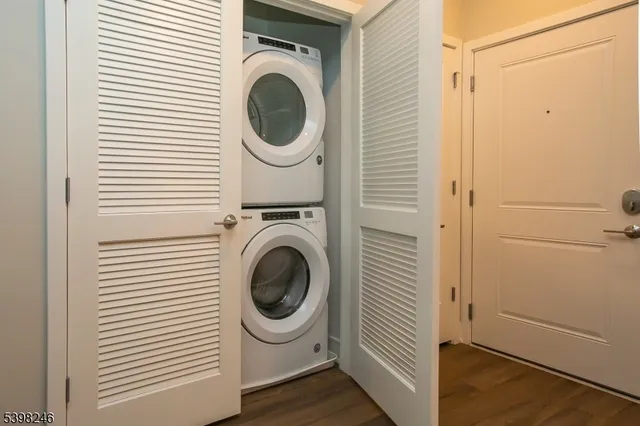 a view of a hallway with washer and dryer
