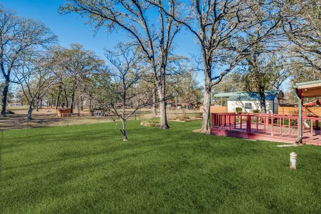 a view of outdoor space with garden and trees