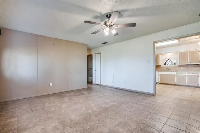 a view of a kitchen with a sink and cabinet