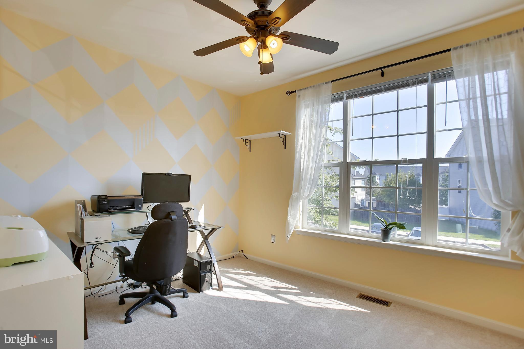 643 Tivoli Road Frederick, MD 21703 - Photo 12 of 30 a view of a workspace with furniture and a window
