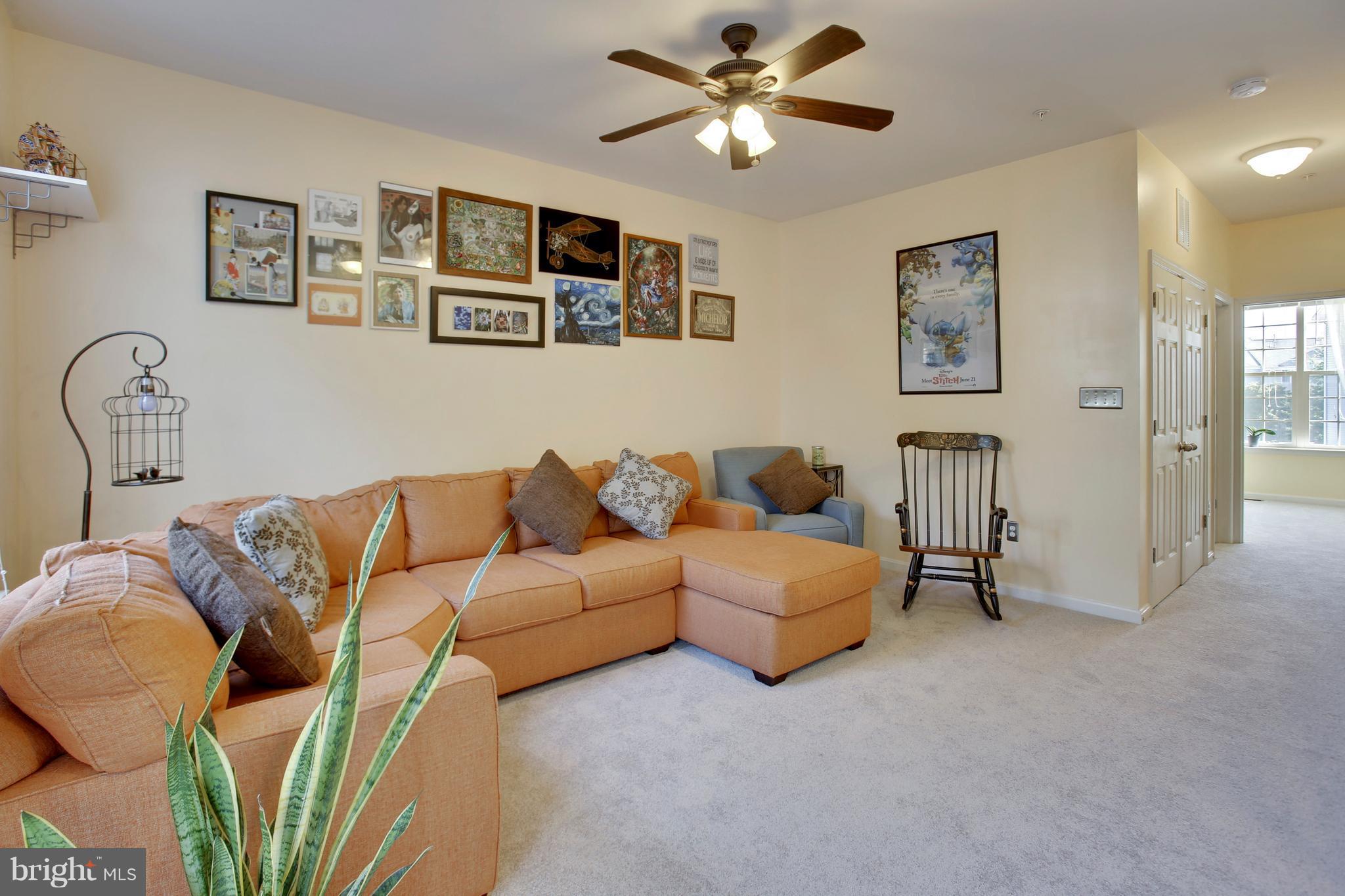 643 Tivoli Road Frederick, MD 21703 - Photo 15 of 30 a living room with furniture and a ceiling fan