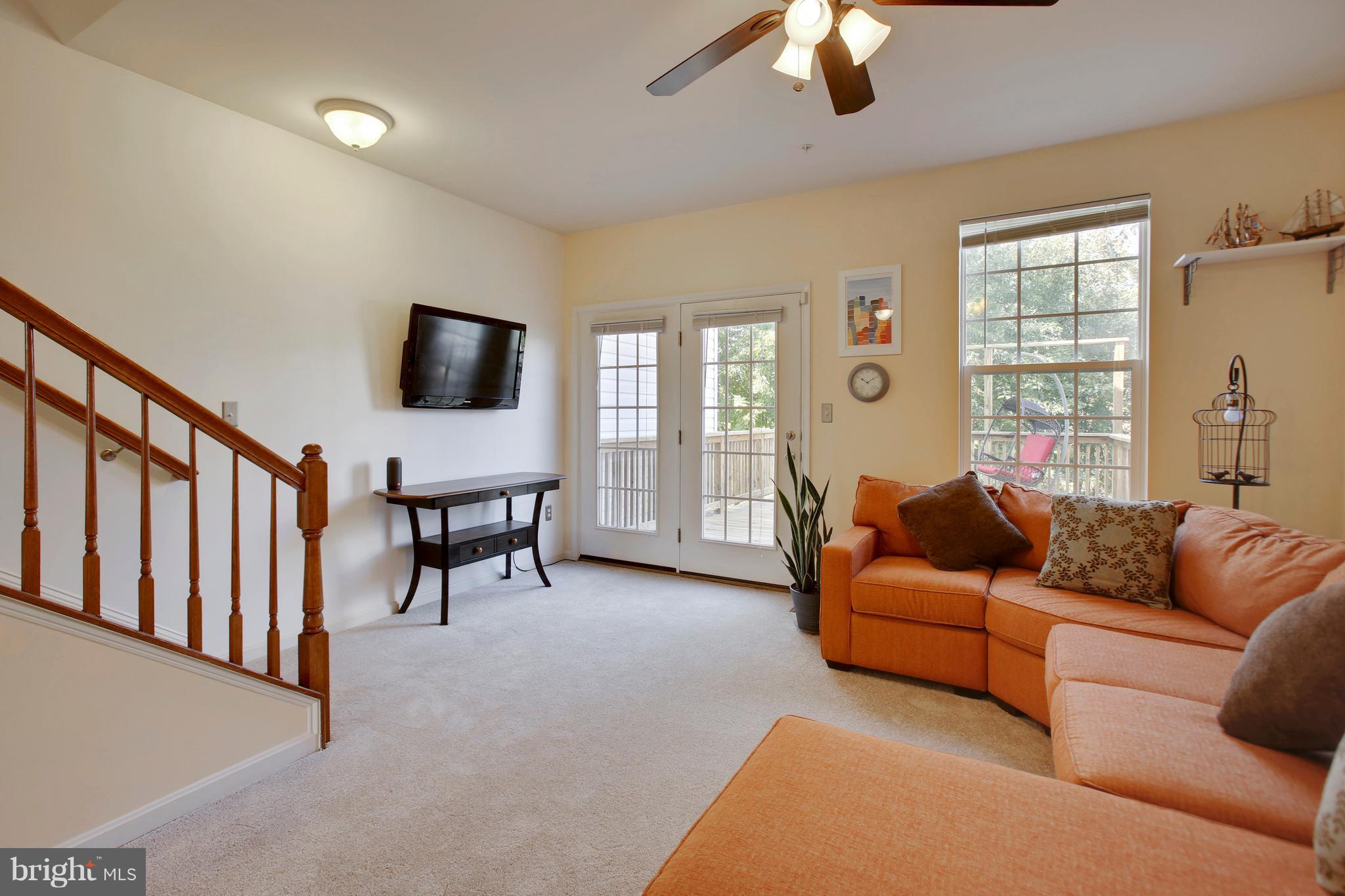 643 Tivoli Road Frederick, MD 21703 - Photo 17 of 30 a living room with furniture and a flat screen tv