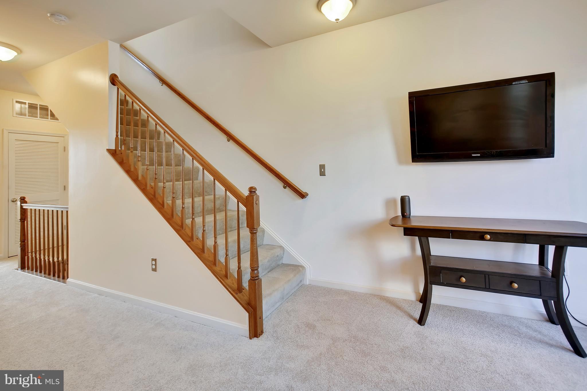 643 Tivoli Road Frederick, MD 21703 - Photo 18 of 30 a view of a livingroom with furniture and a flat screen tv