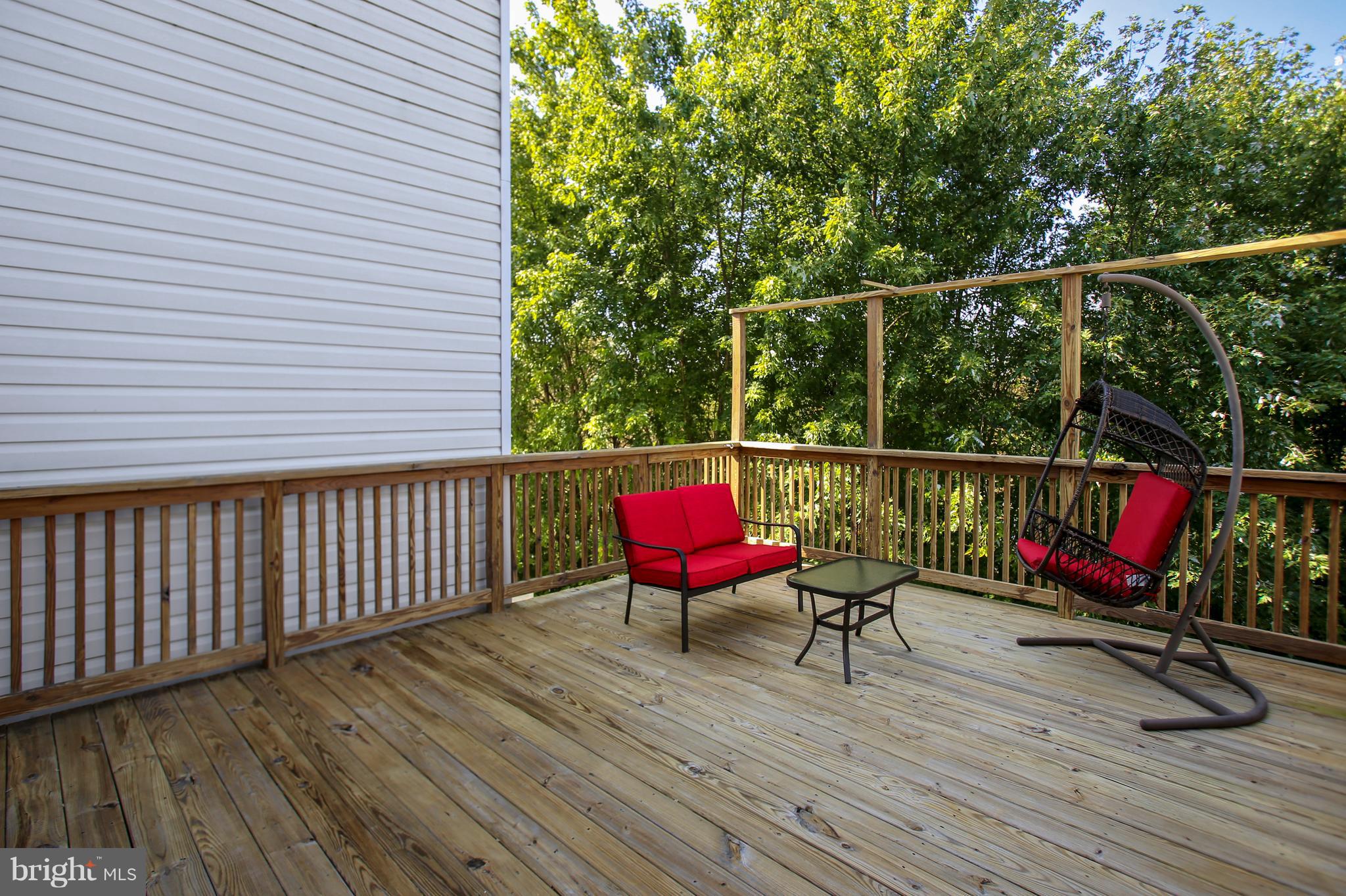 643 Tivoli Road Frederick, MD 21703 - Photo 20 of 30 a view of deck with wooden floor and outdoor seating