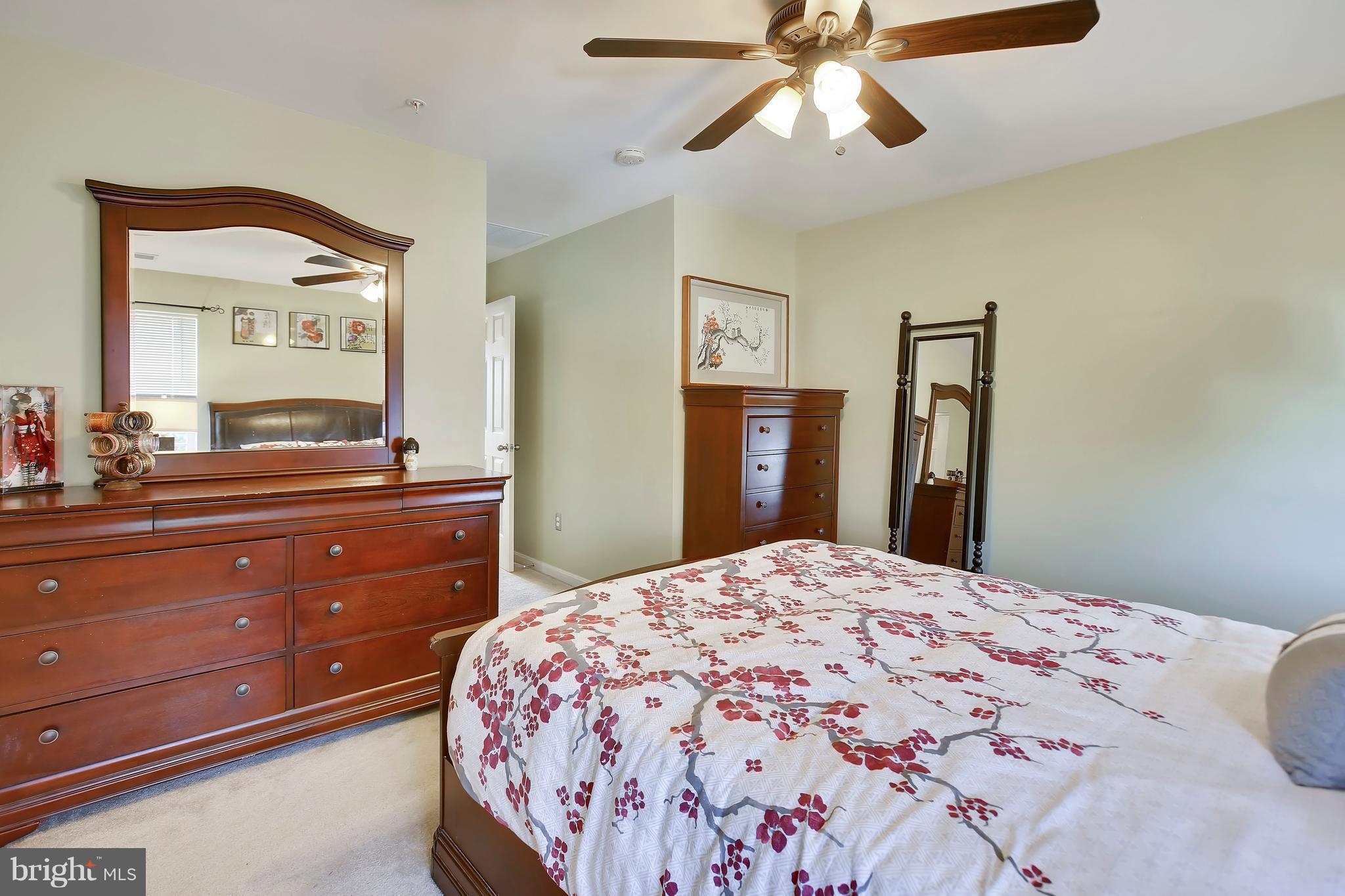 643 Tivoli Road Frederick, MD 21703 - Photo 24 of 30 a bedroom with a bed and a dresser