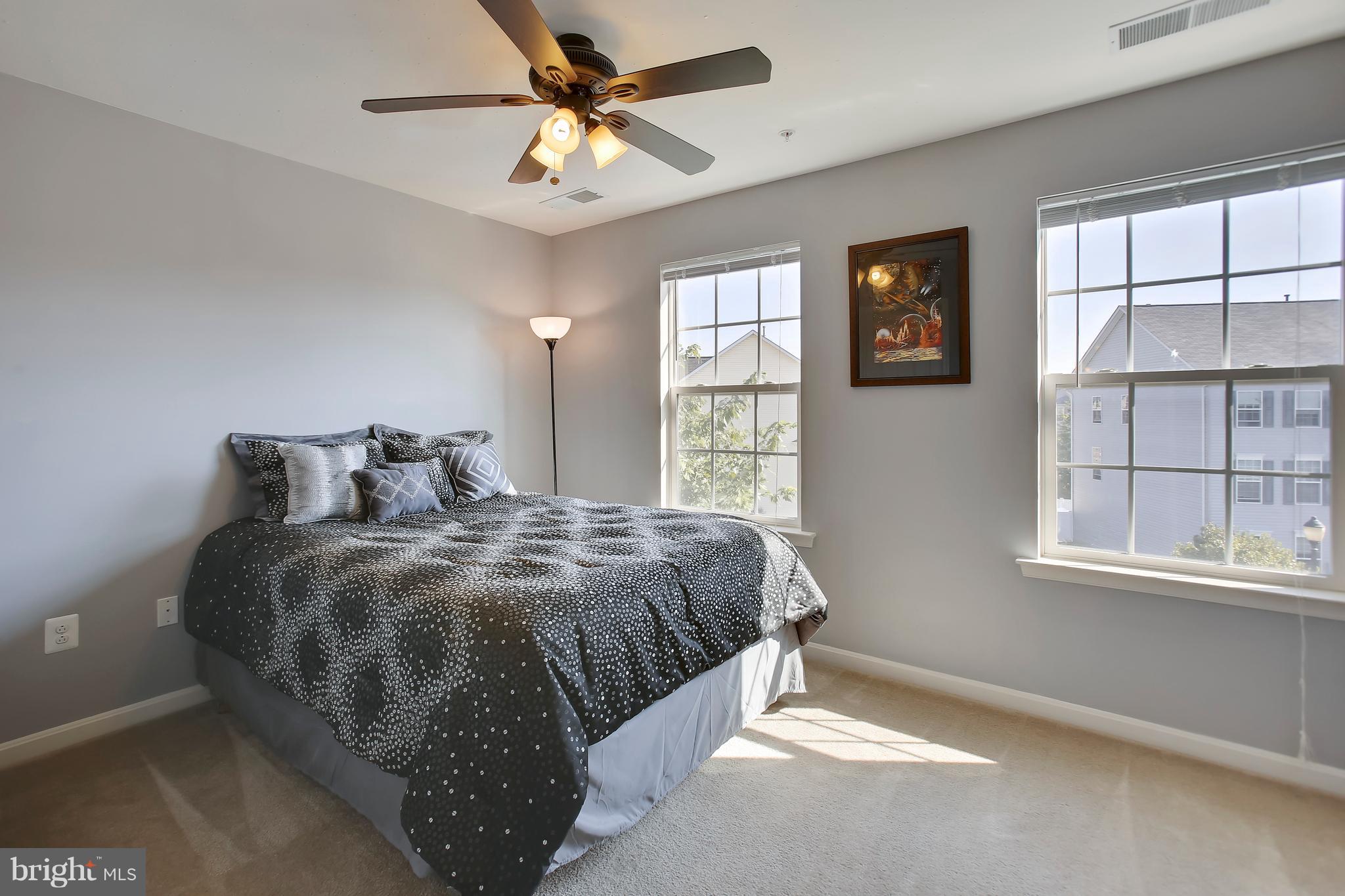 643 Tivoli Road Frederick, MD 21703 - Photo 25 of 30 a bed sitting in a bedroom next to a window