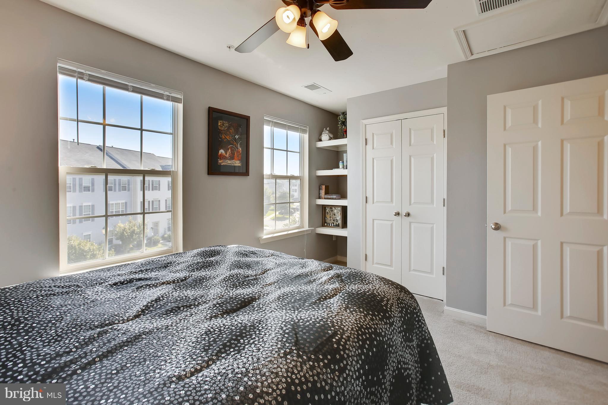 643 Tivoli Road Frederick, MD 21703 - Photo 26 of 30 a bedroom with a large bed closet and window